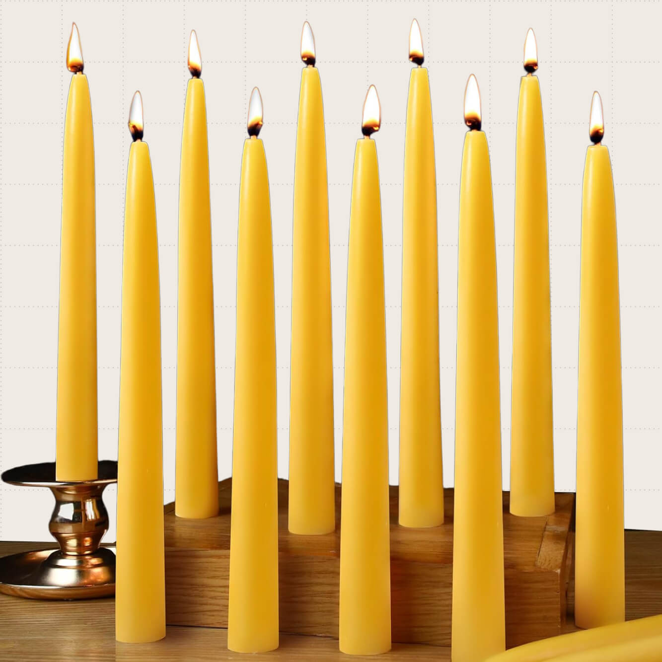 Capaniel Natural Beeswax Taper Candles, 12-Pack. Each candle is 10 inches tall.
