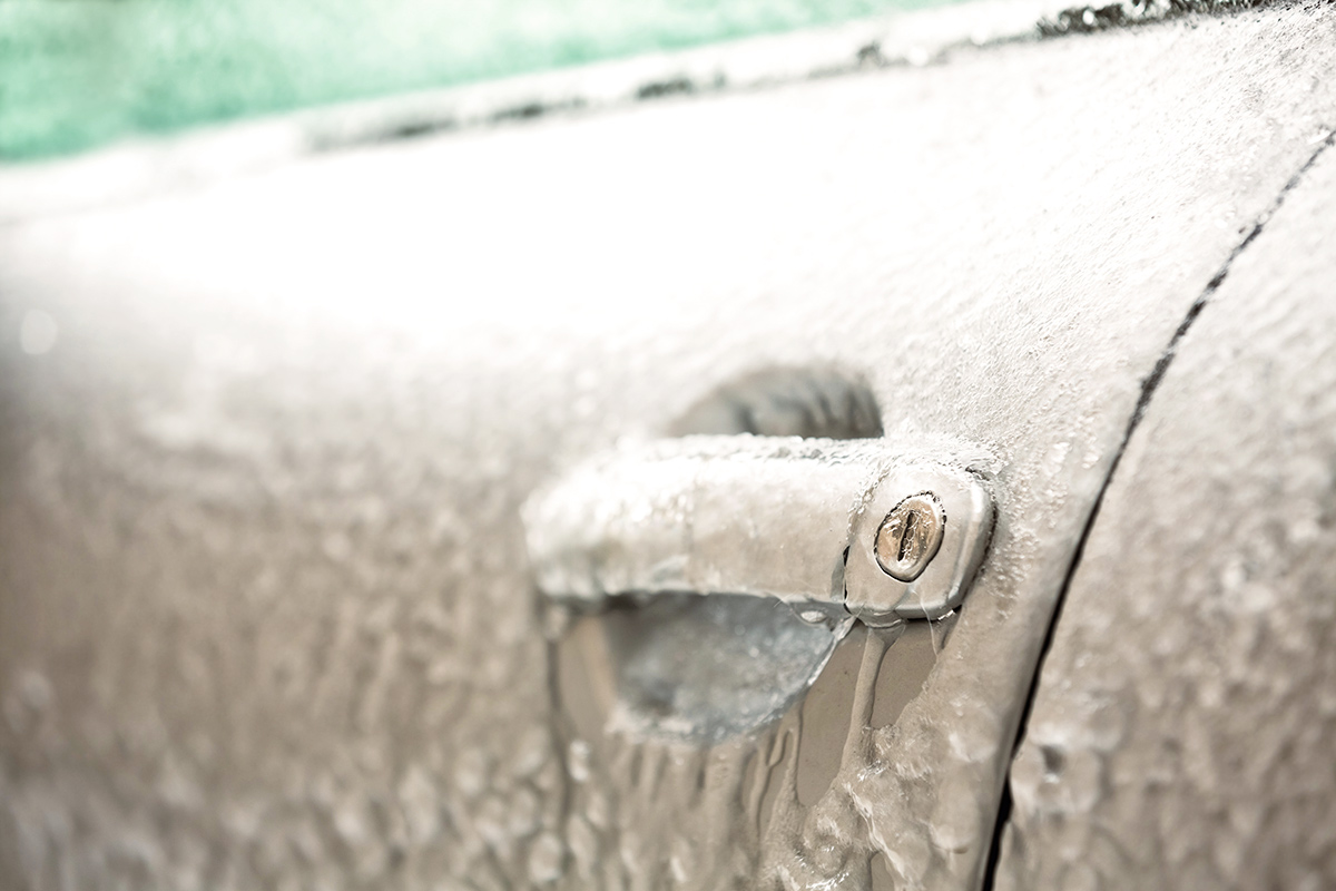 Frozen keylock of a car with icicles