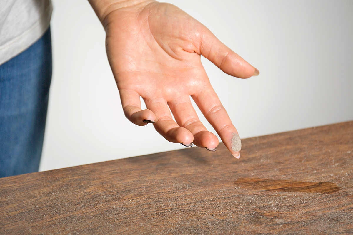 Anonymous person who appears to have just wiped their finger across a dusty tabletop.